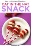 Three strawberry banana snacks that look like the cat in the hat's hat on a plate with text title overlay.