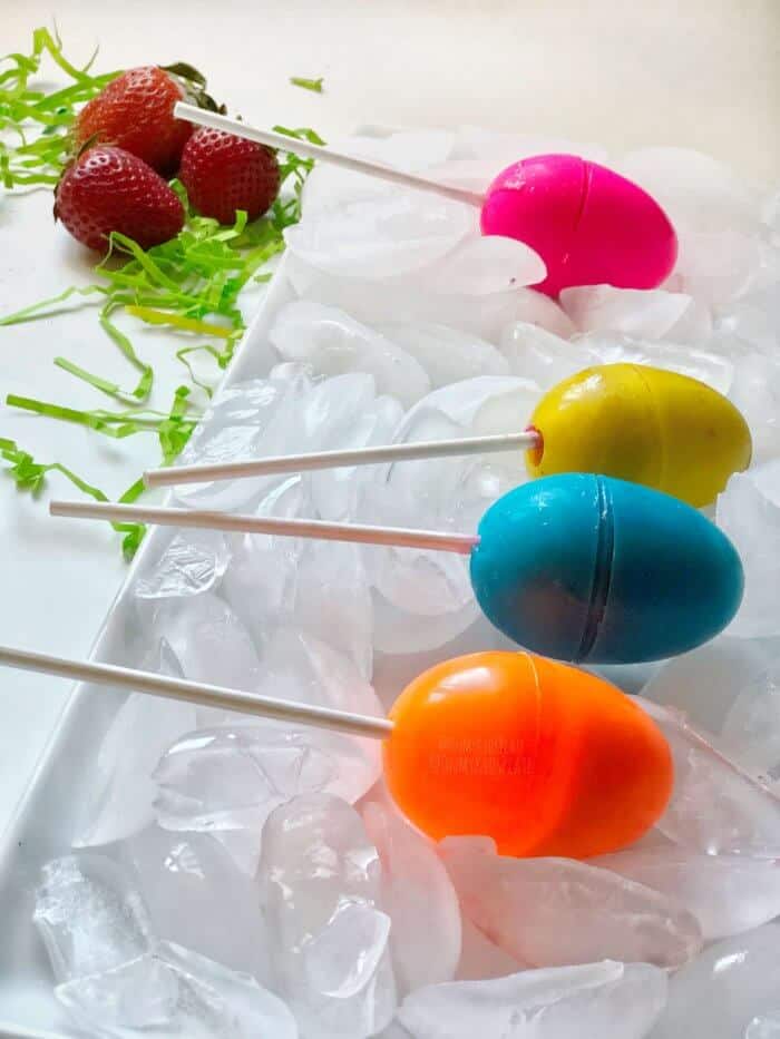 Easter Egg Popsicles on a tray of ice