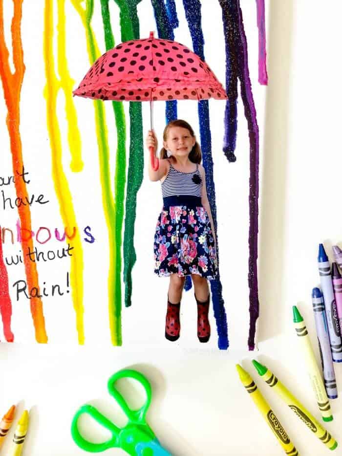  a close up of a child holding an umbrella on a canvas