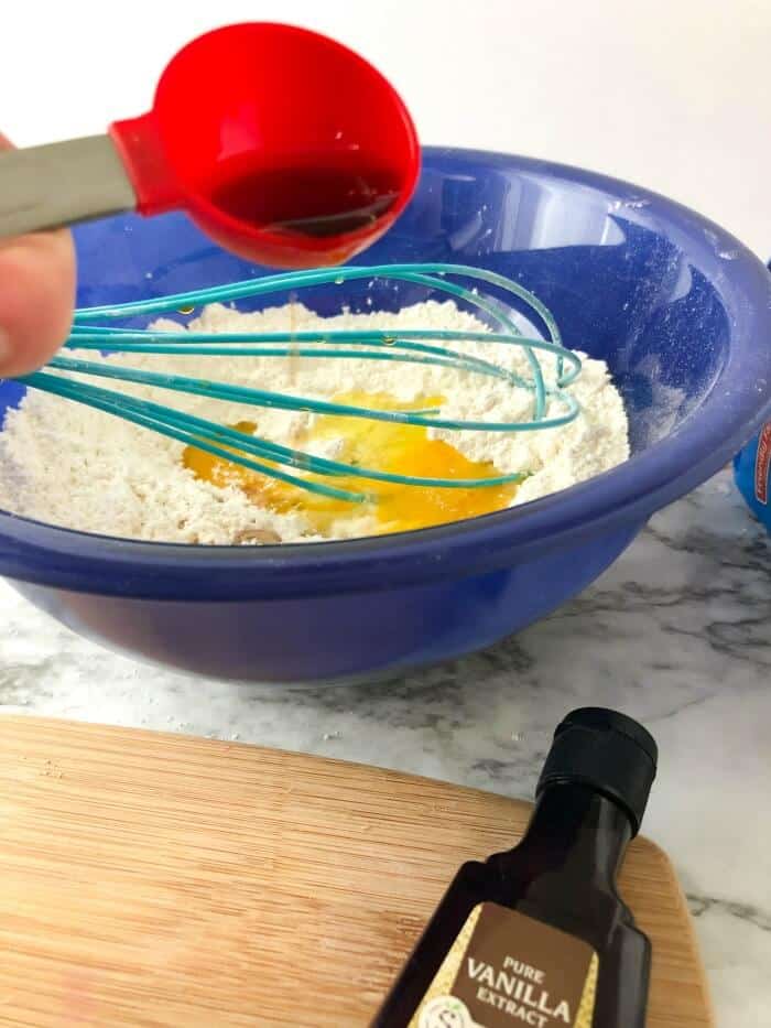Vanilla being added to almond milk pancake batter