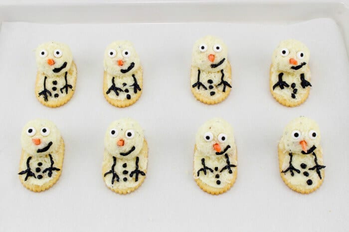 Finished cheese ball and cracker snowmen
