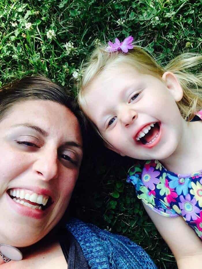 A little girl and an women from overhead laughing and posing for a picture