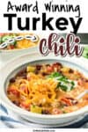 Turkey chili in a bowl topped with cheese with title award winning turkey chili across the top of the image.