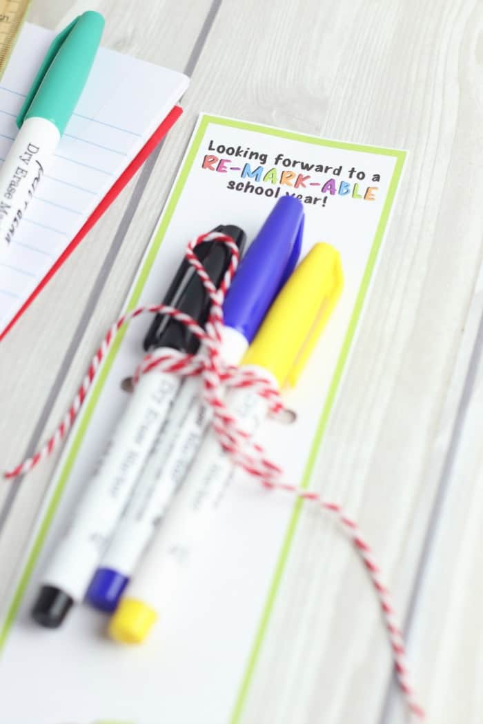 Markers tied to a gift tag that says \"looking forward to a re-mark-able\" school year