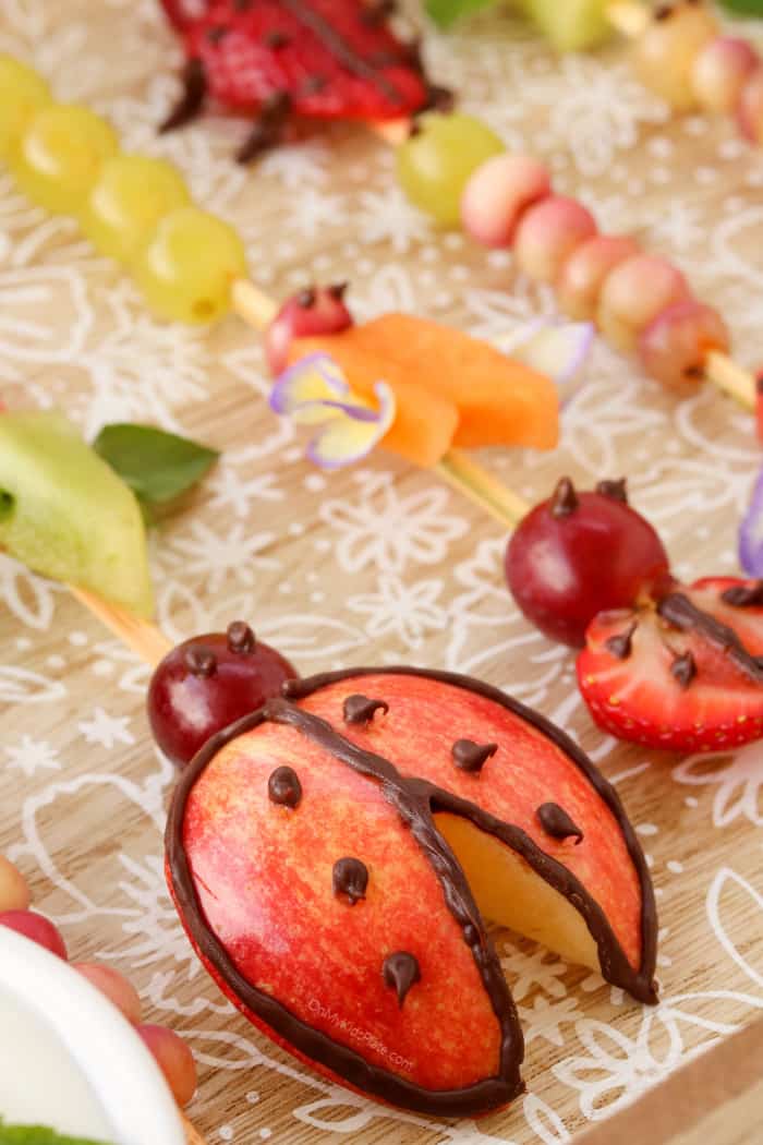 Fruit skewers decorated like lady buys