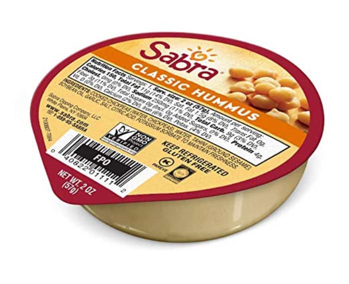A individual sized container of Sabra hummusus