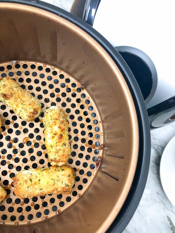 Panko coated string cheese in the air fryer brown after cooking