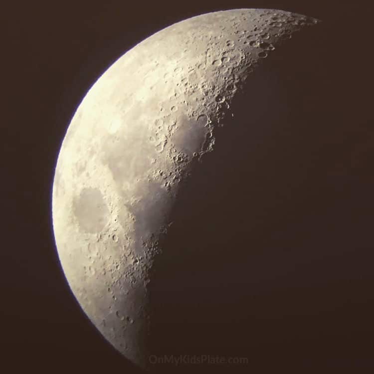 A large picture of the moon in a waning gibbous phase.