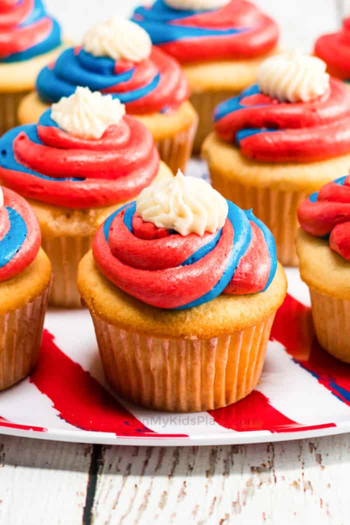 A cupcake with red white and blue frosting