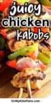 An overhead view close up of grilled chicken kabobs cooked and plated for dinner.