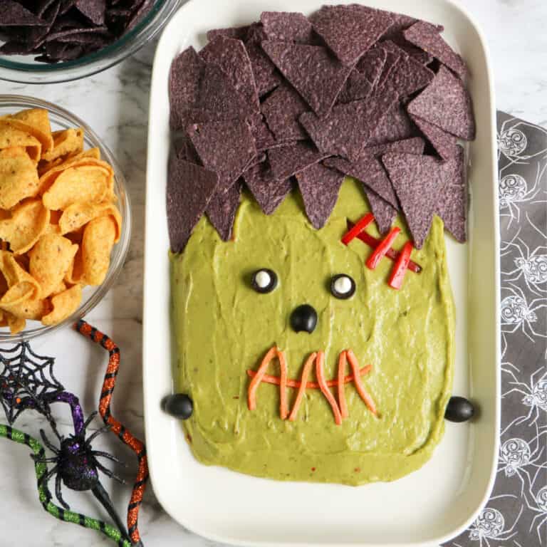 Close up of guacamole platter decorated like the monster Frankenstein