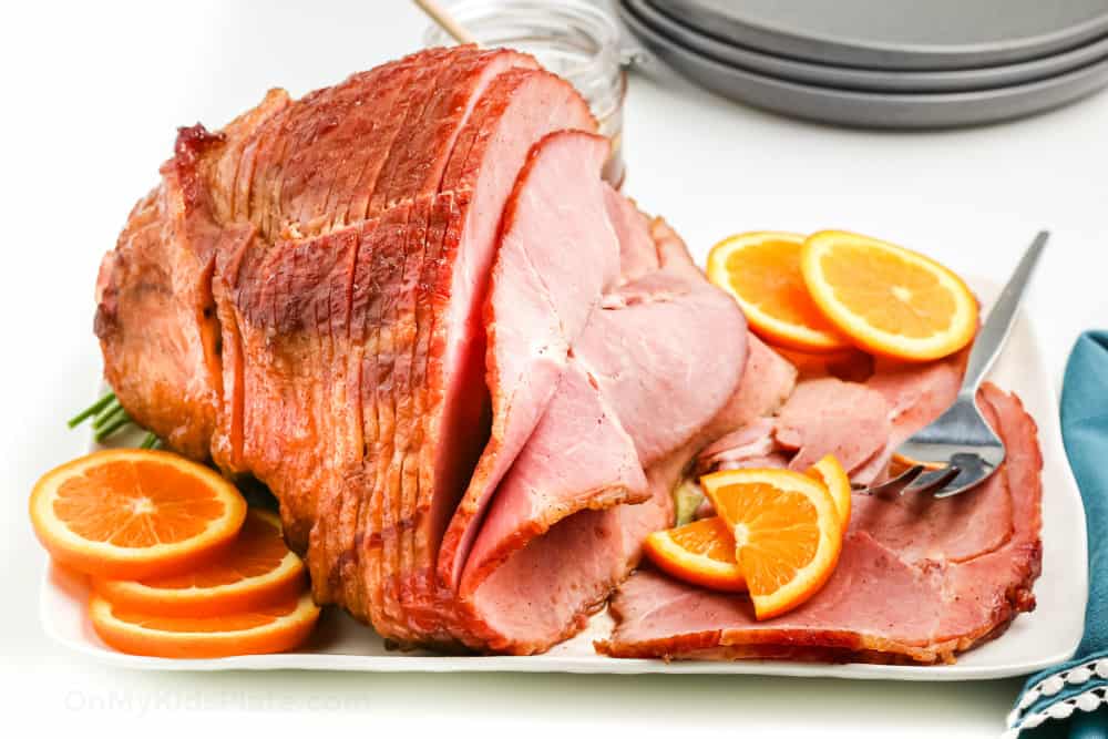 Side view of ham full ham platter on the table.