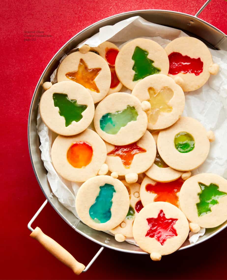 Christmas ornament shaped stained glass cookies on a serving plate
