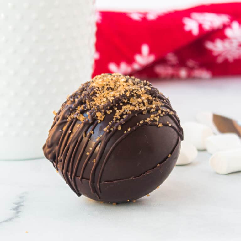 Close up of a ot cocoa bomb topped with raw cane sugar