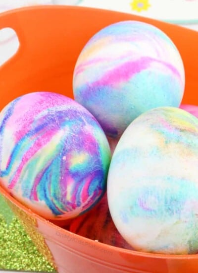 Close up of Easter Eggs swirled with color in a basket
