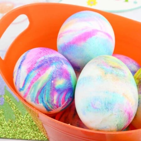 Close up of Easter Eggs swirled with color in a basket