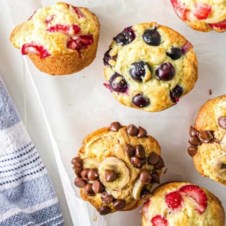 Up close image of strawberry, blueberry and chocolate chip banana pancake mix muffins.