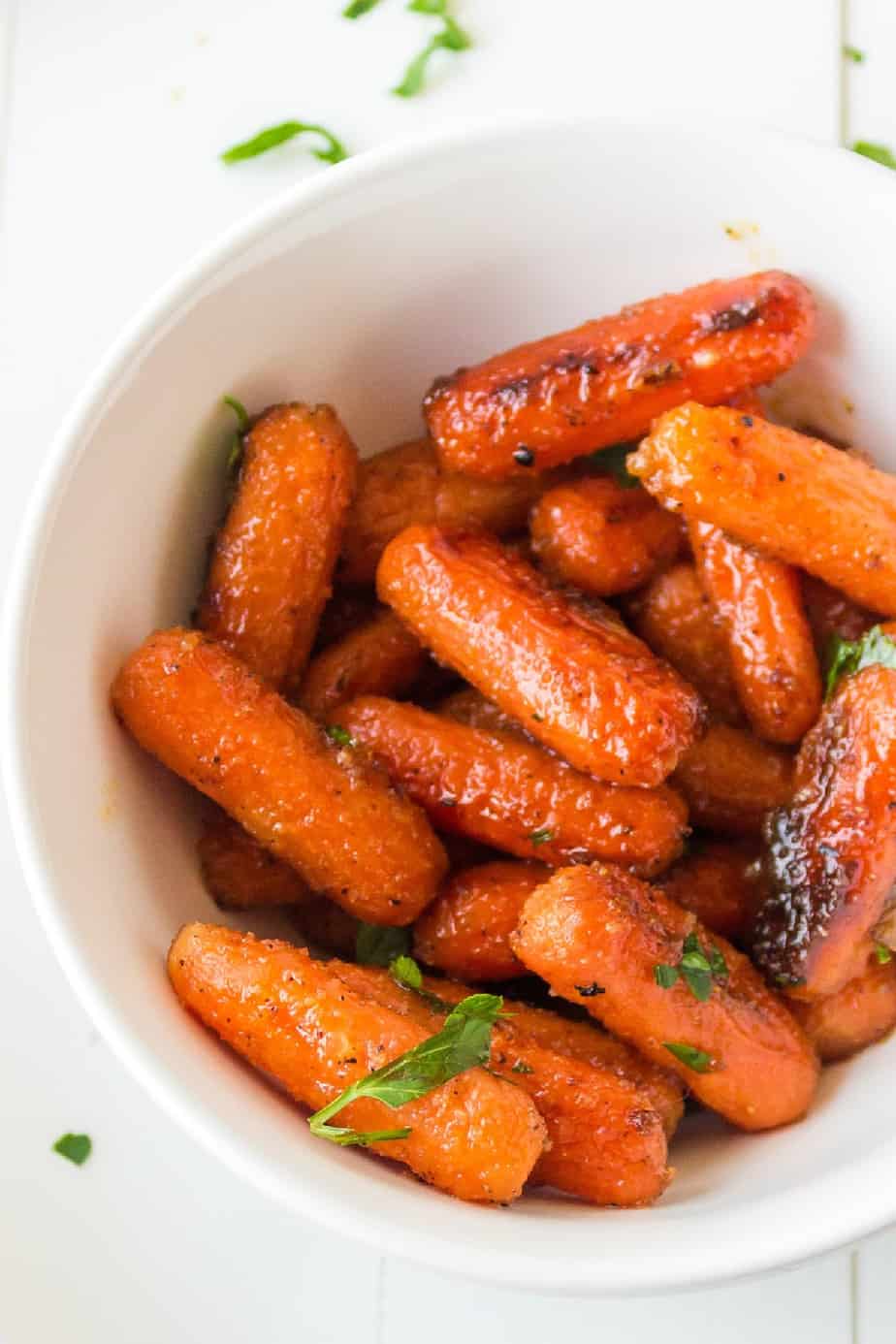 Overhead of roasted baby carrots in a bowl