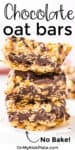 Stack of three chocolate oat bars up close with text title overlay on the top