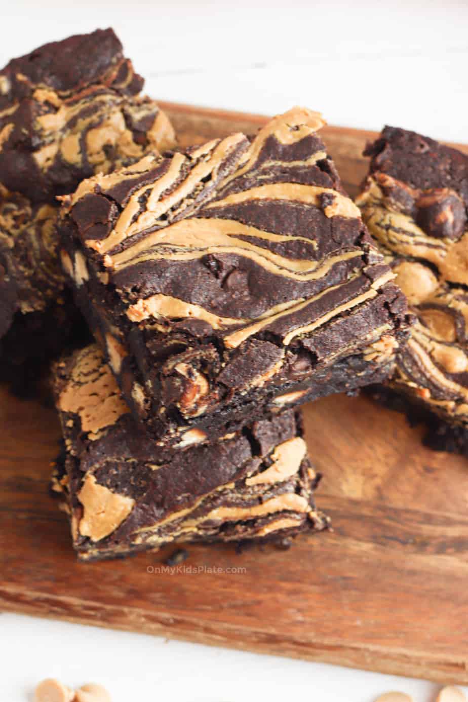 Chocolate brownies swirled with peanut butter from overhead stacked on a platter.