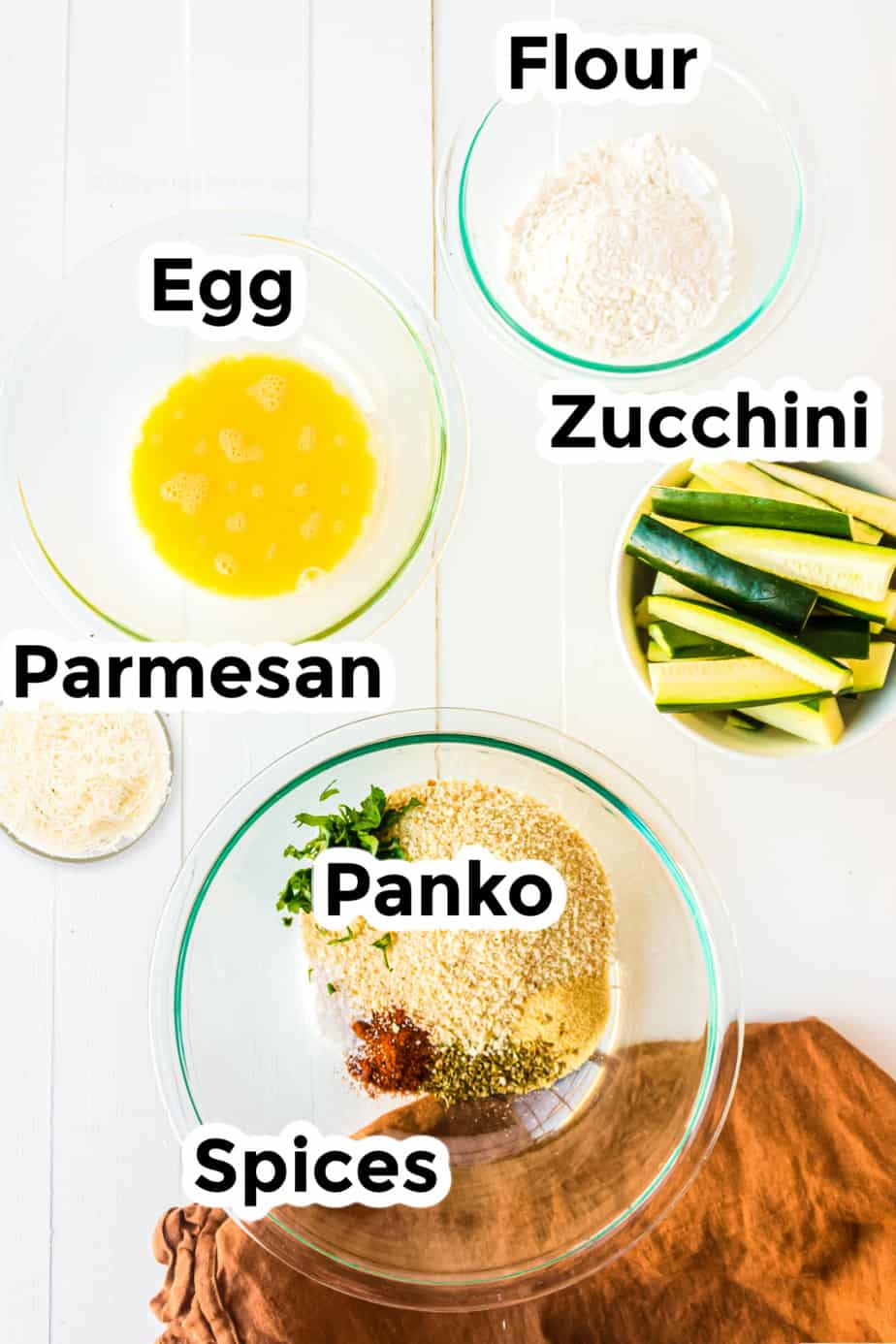 Ingredients in bowls for Parmesan Garlic Zucchini Fries
