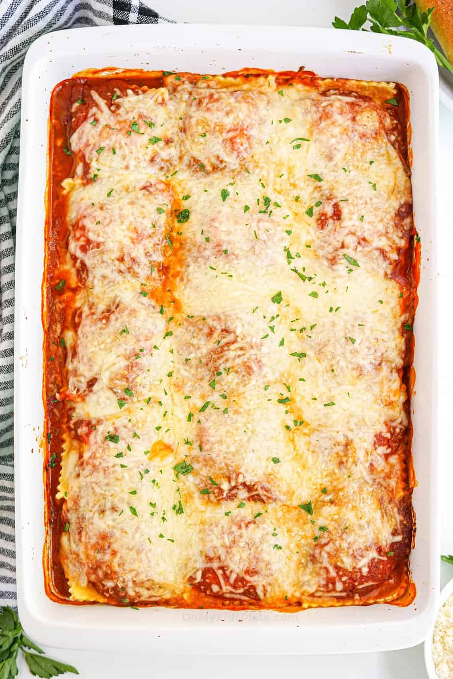 Baked ravioli in a casserole dish from overhead fully cooked.