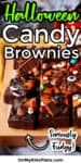 Brownies decorated for Halloween with candy sliced on a cutting board with text title overlay.