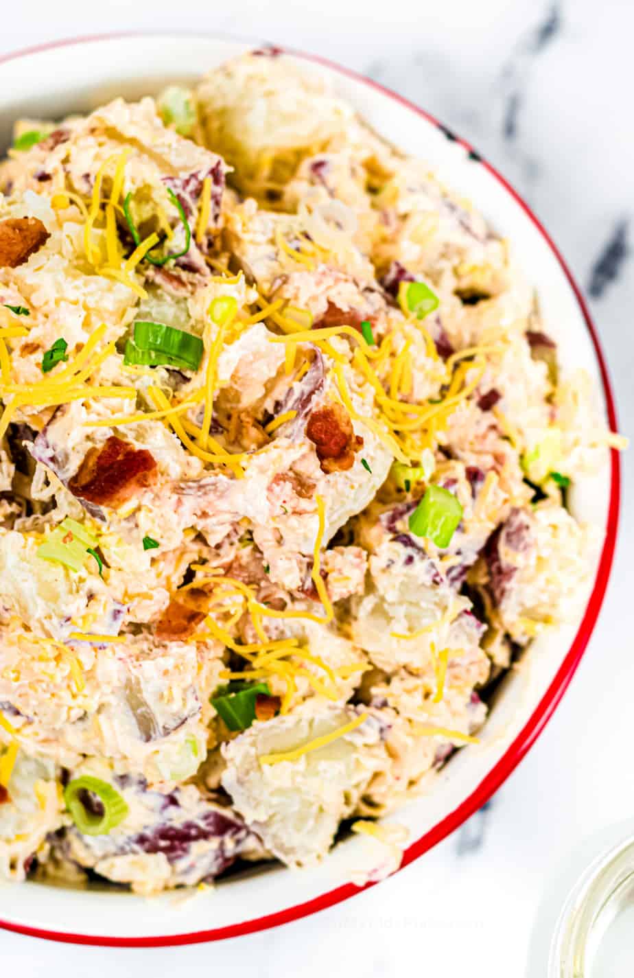 Loaded potato salad in a bowl