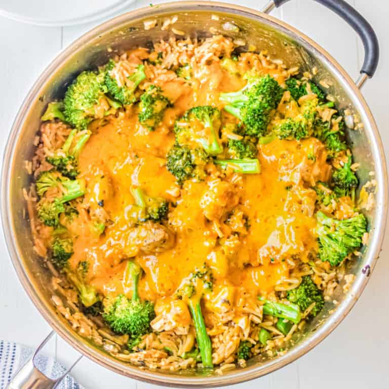 Cheesy chicken broccoli rice dish in deep skillet