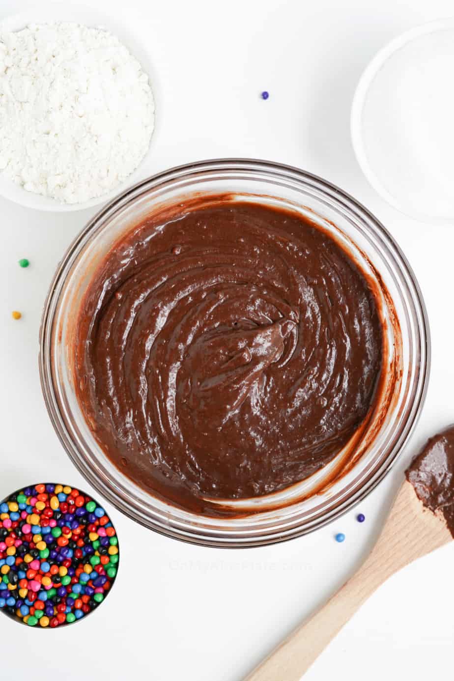 Mixing dry ingredients into cosmic brownie batter
