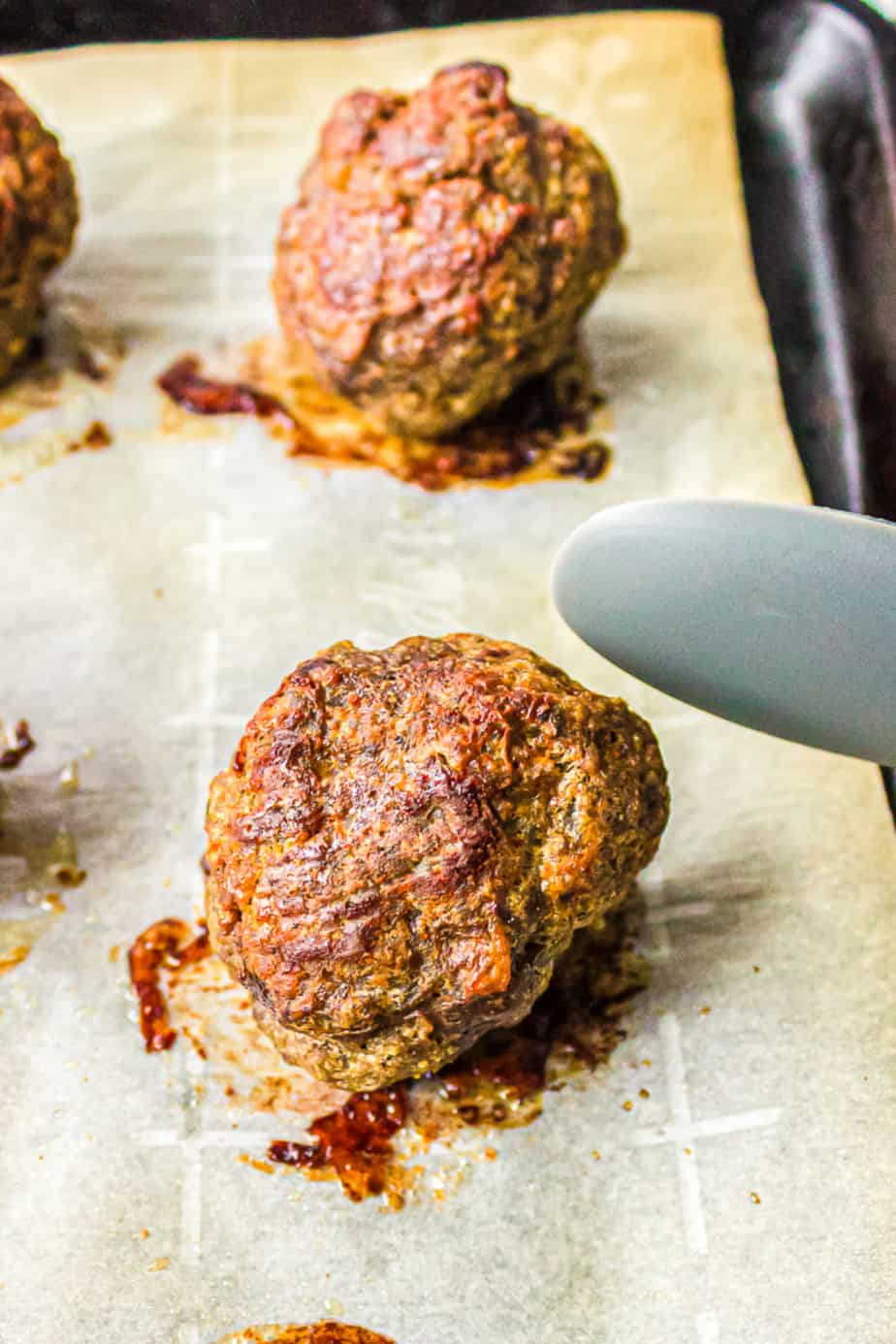 Baked beef meatballs on a pan close up