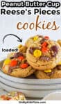 Peanut butter cup and reese's pieces covered cookies stacked on a plate with title text overlay