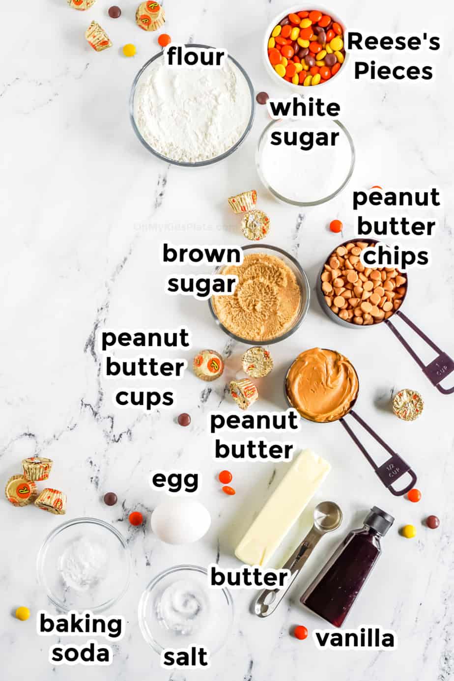 Ingredients in bowls for Reese's Pieces Peanut Butter Chip Cookies from above labeled.
