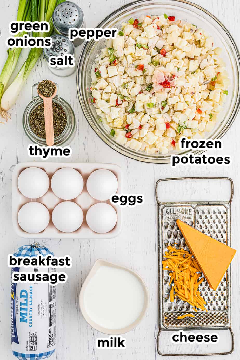 Ingredients in bowls from overhead with labels for sausage potato breakfast casserole