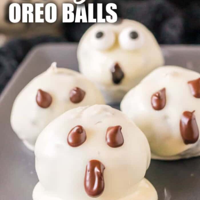 Chocolate truffles covered in white chocolate decorated like ghost.