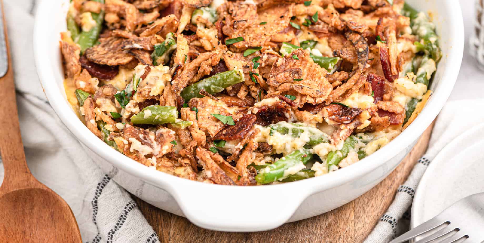 Side view of green bean casserole in a casserole dish