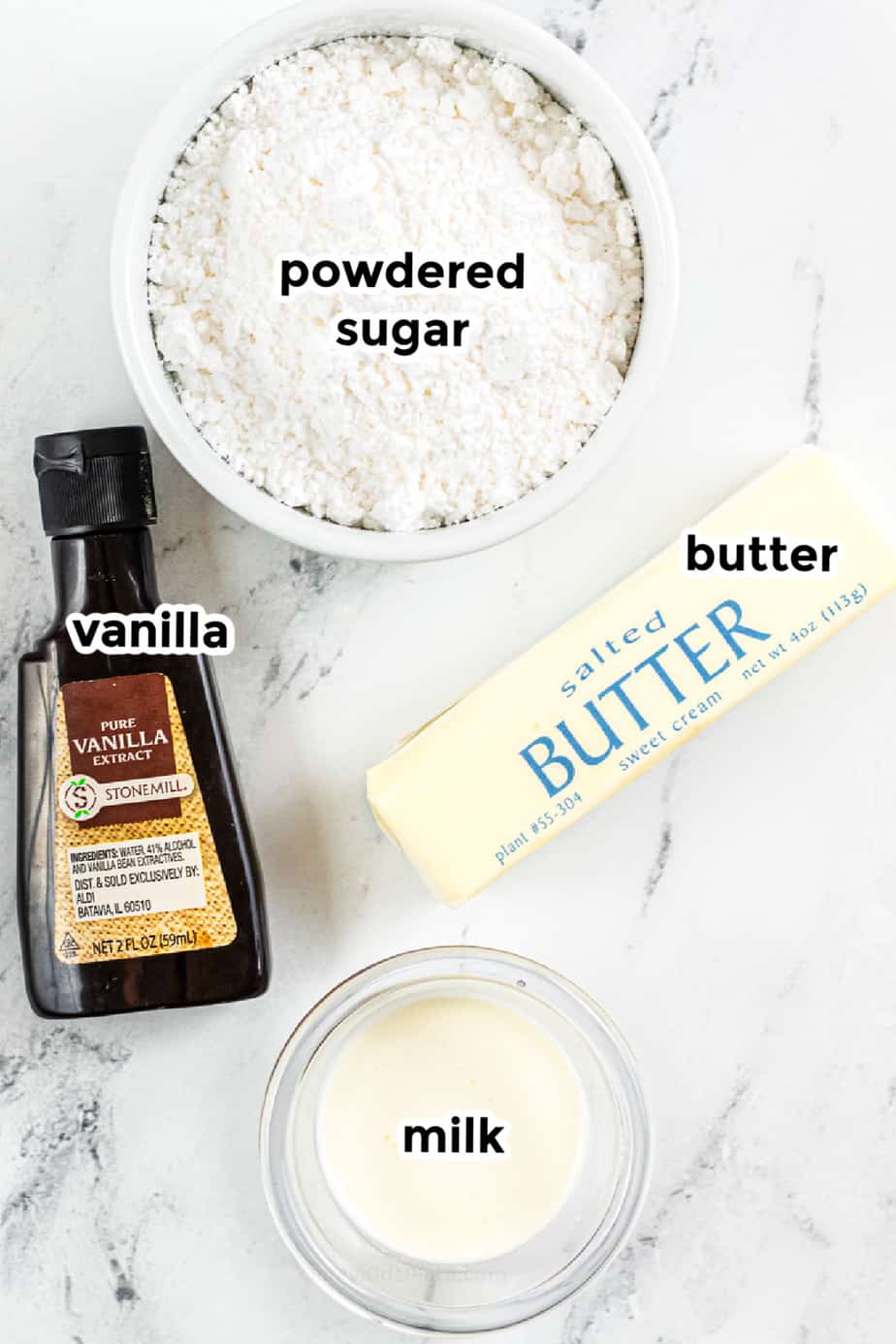 Ingredients for frosting in bowls with labels.