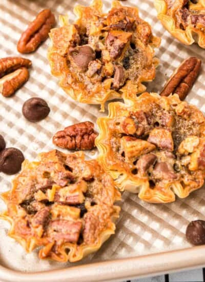Mini pecan chocolate pies close up on the pan