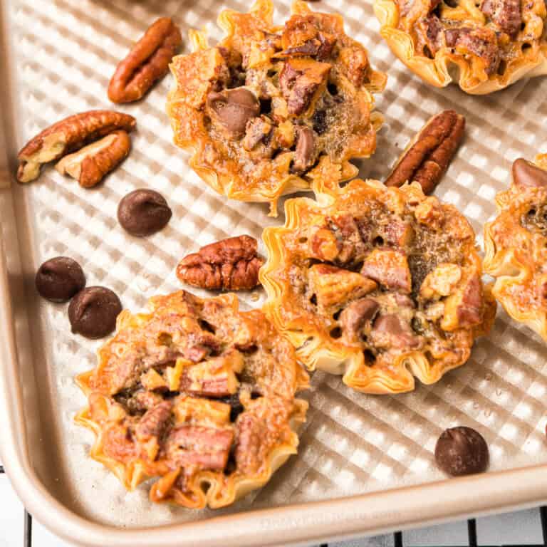 Mini pecan chocolate pies close up on the pan