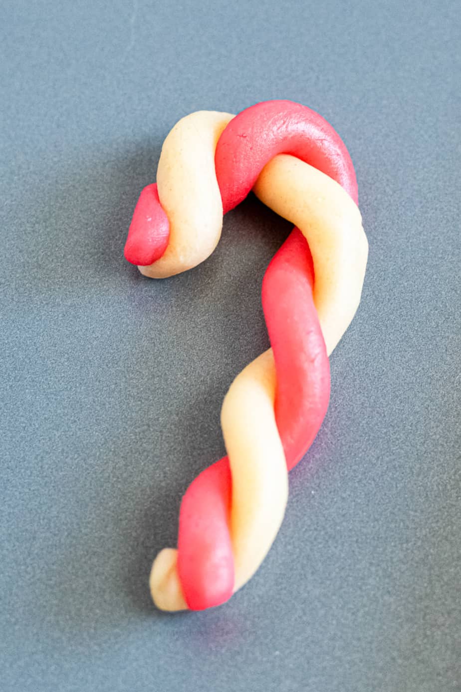Twisted cookie dough shaped like a candy cane  close up