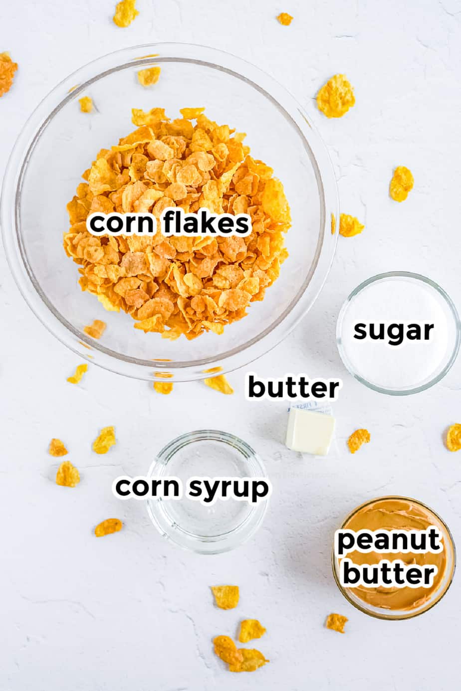 Ingredients for cornflake cookies on bowls with labels