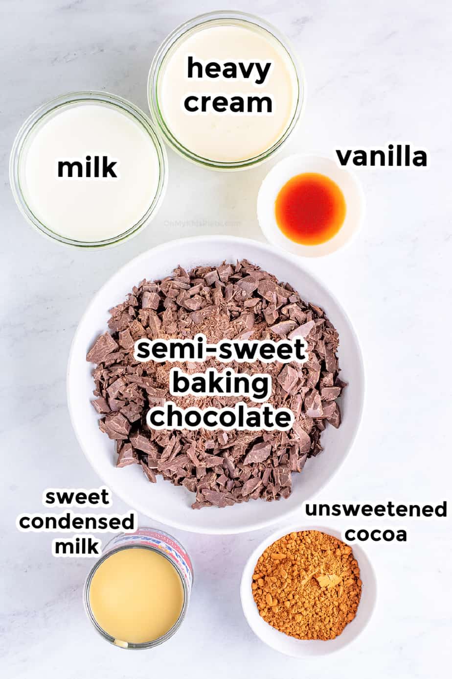 Ingredients in bowls with labels from overhead for slow cooker hot chocolate