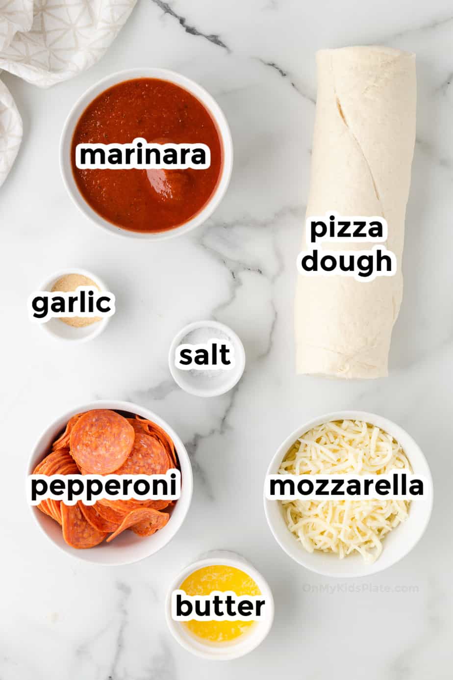 Ingredients for pepperoni rolls in bowls with labels