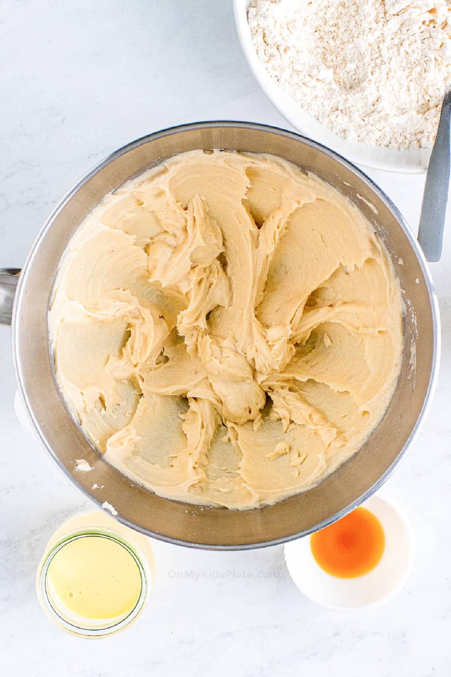 Creaming butter for eggnog cookie dough in a mixing bowl