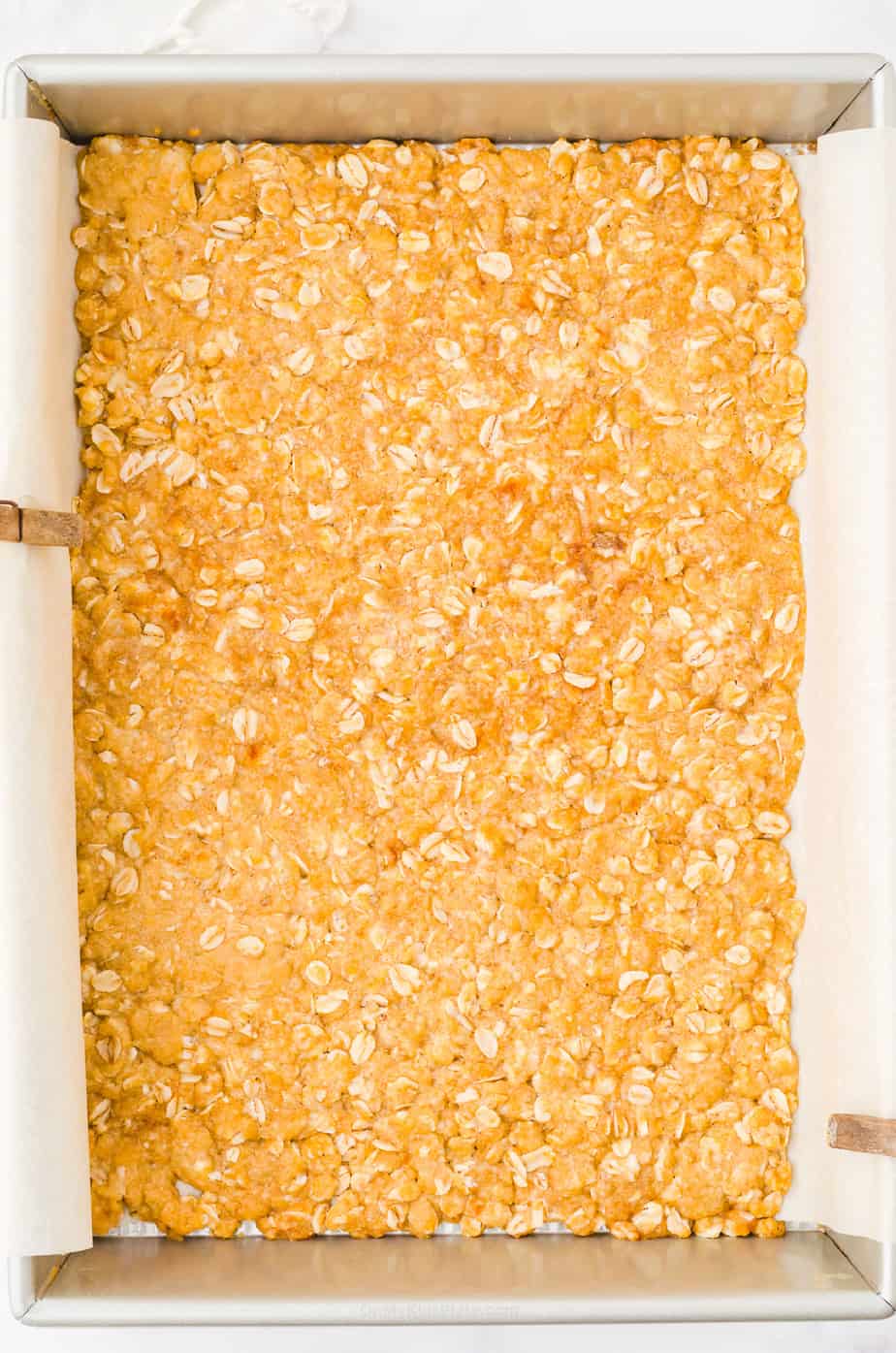 Oat layer pressed into a pan and baked