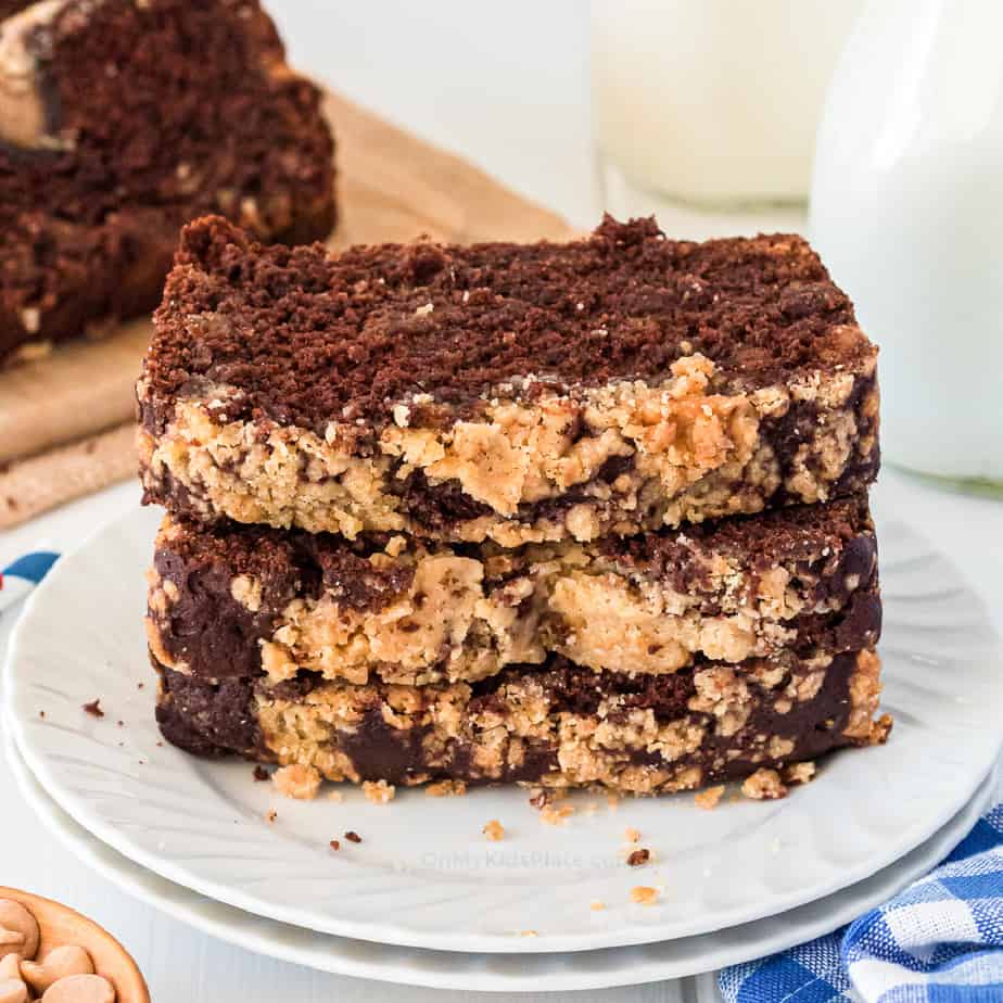 Stack of chocolate peanut butter loaf sliced and stacked on a plate from the side