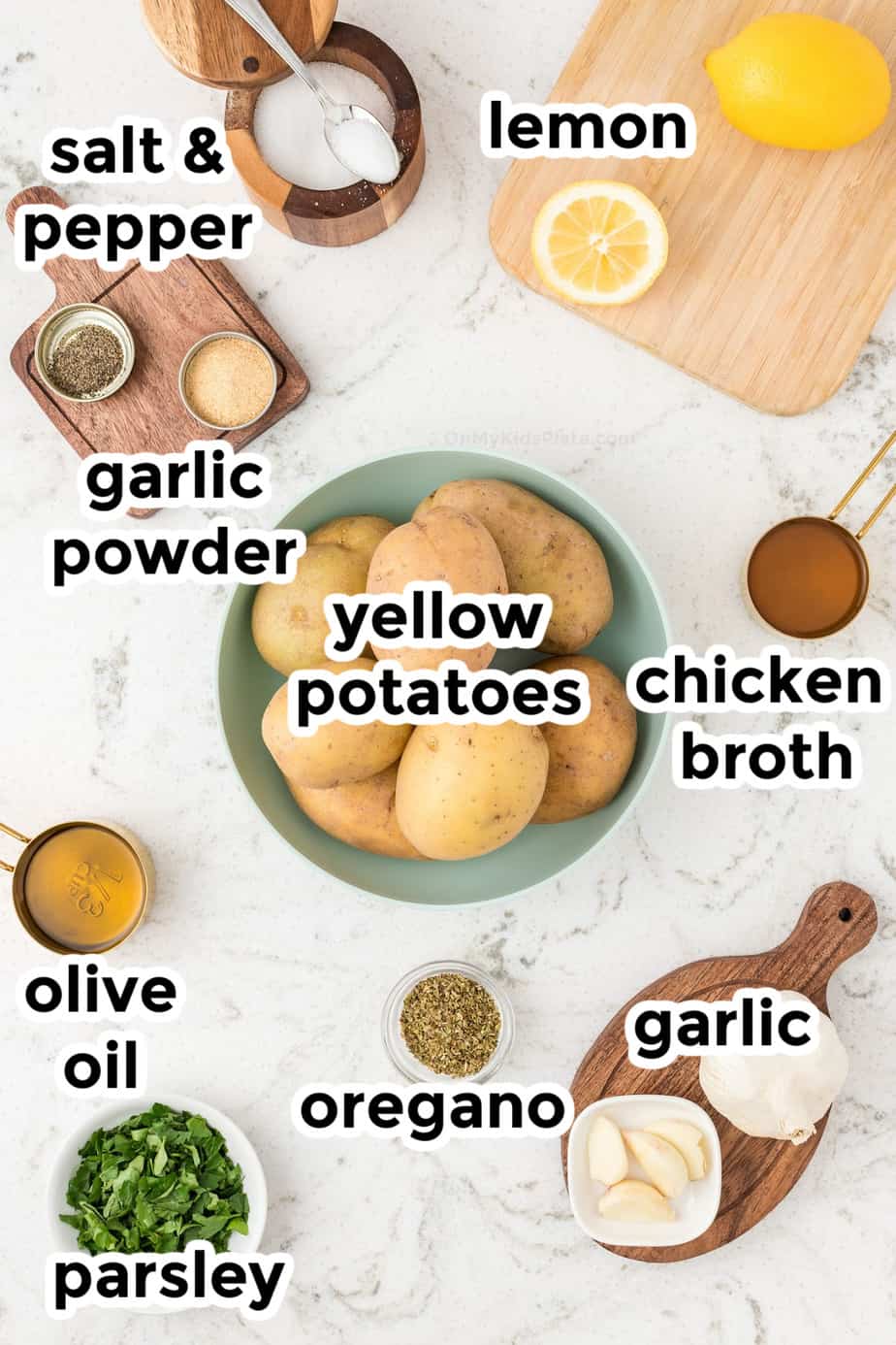 Ingredients for greek roasted potatoes in bowls with labels