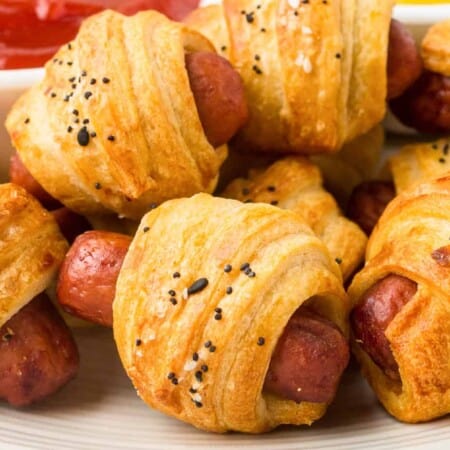 Close up of stacked pigs in a blanket up close from the side