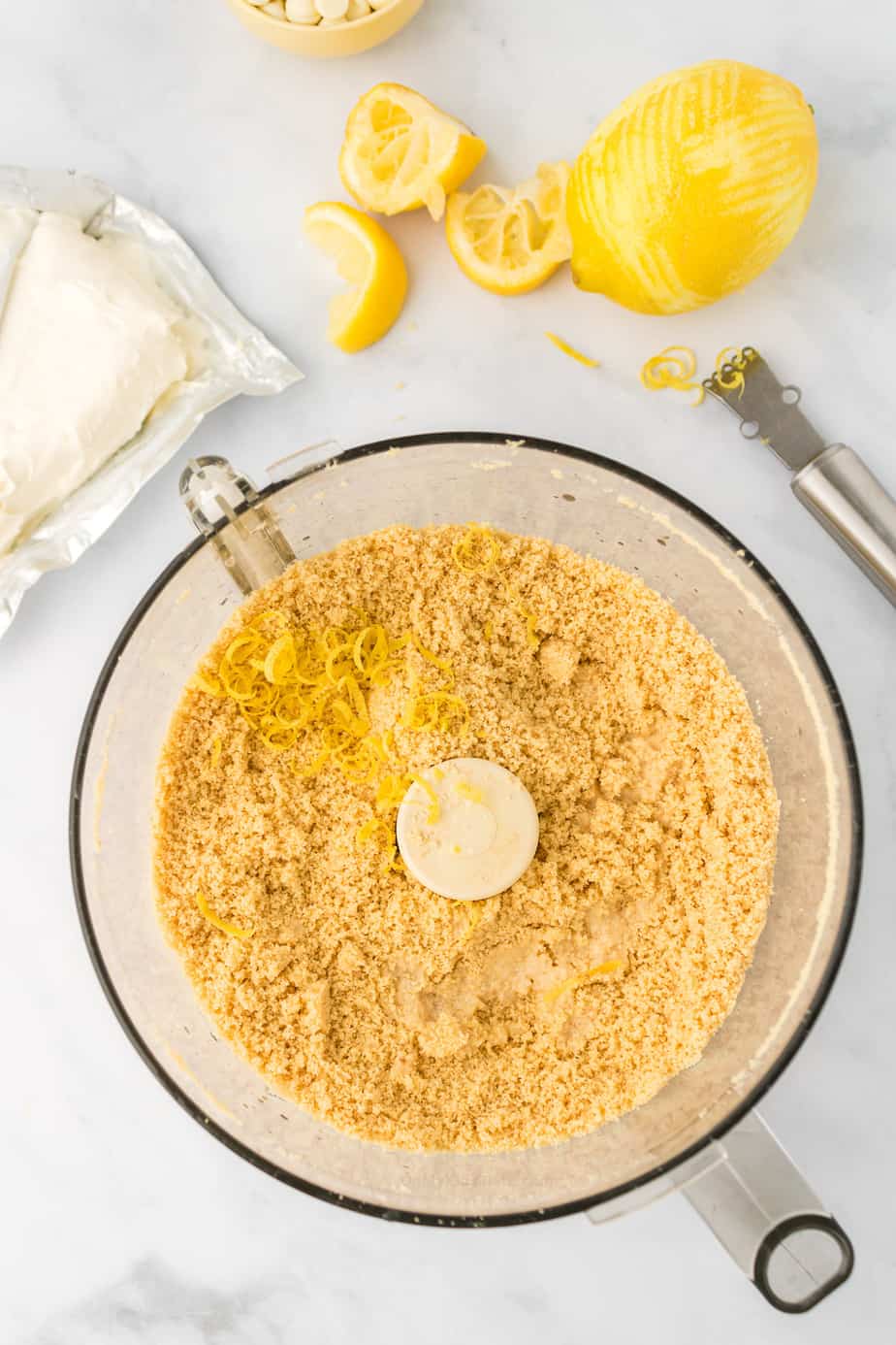 Mixing lemon juice and zest with Golden Oreo crumbs in food processor