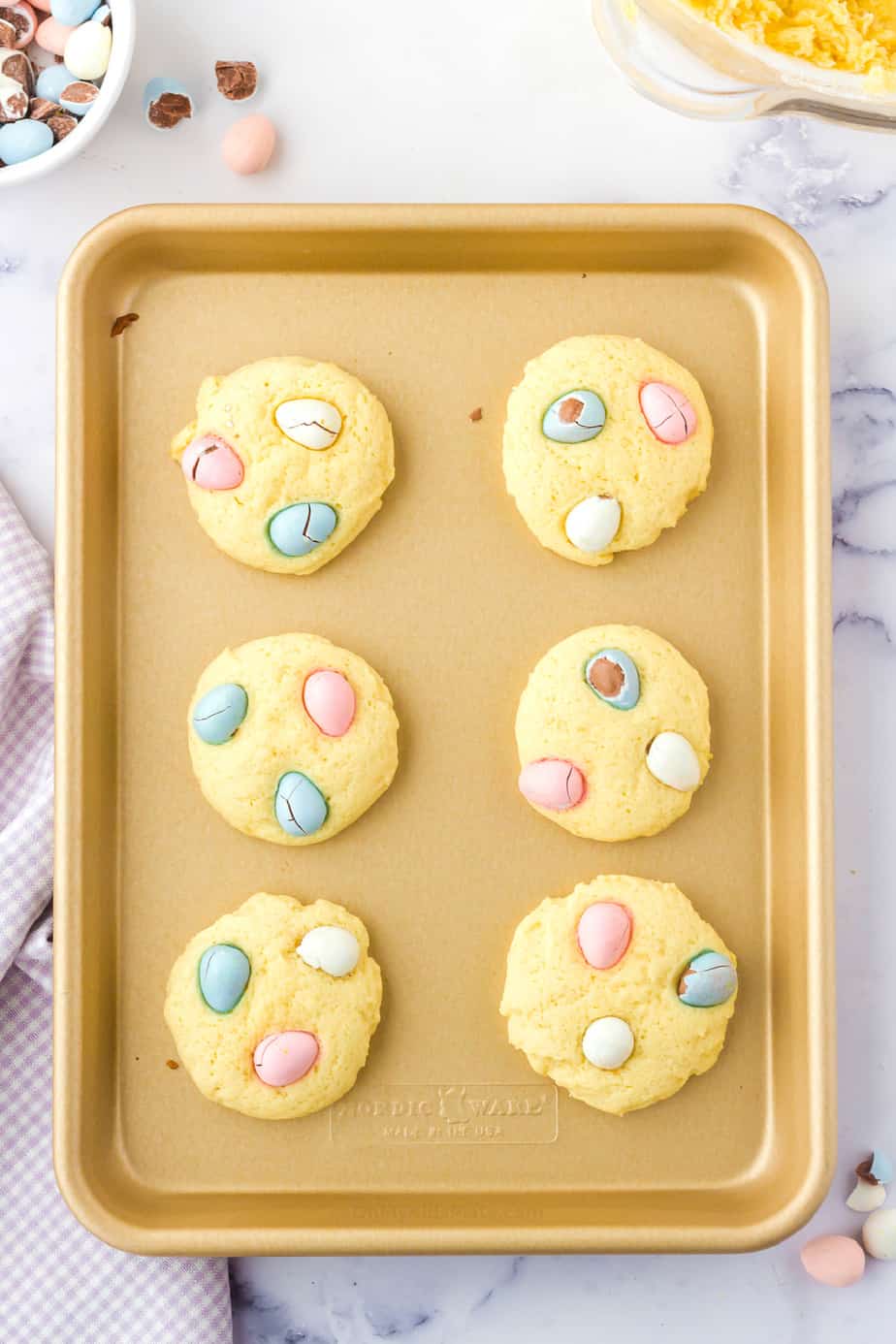 Bake mini egg cookies on pan